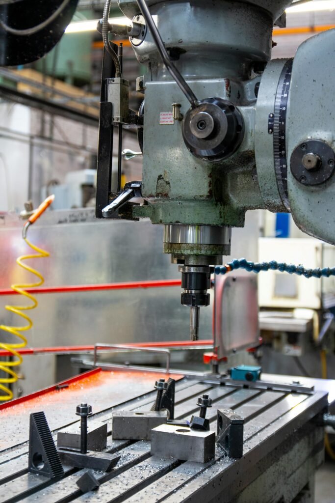 Close-up of a lathe machine in a workshop setting, showcasing precision engineering.